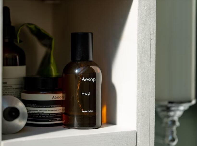 Bathroom-shelf-with-a-bottle-of-perfume-