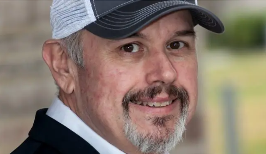 A-head-shot-of-Vernon-Corum-wearing-a-baseball-cap-and-looking-at-the-camera